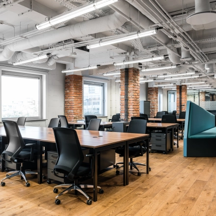 Spacious office to rent at Konstruktorska 11, Warsaw Mokotow, featuring modern furniture and open floor plan ideal for collaborative work.