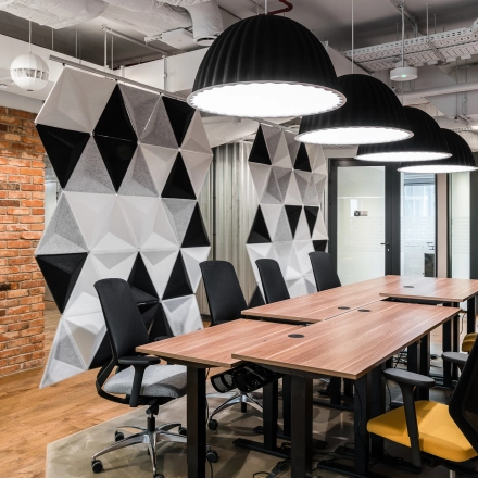 Modern office space at Konstruktorska 11, Warsaw Mokotow, featuring stylish furnishings and geometric decor, ideal for rent office space seekers.