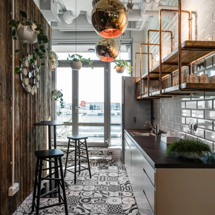 Modern and stylish kitchen area in an office space located at Konstruktorska 11, Warsaw Mokotow, ideal for office space rental.