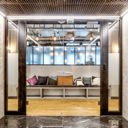 Cozy office space at Koszykowa 65 in Warsaw Śródmieście with a modern design, featuring comfortable seating. Ideal for those looking to rent office space with unique style.
