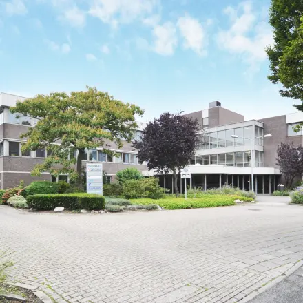 Exterior view of office building at Houttuinlaan 4, Woerden, ideal for office space rental.