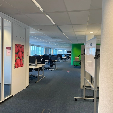 Modern office space available for rent at Baron de Coubertinlaan 35, Zoetermeer. The interior features a spacious, well-lit workspace with desks and chairs.