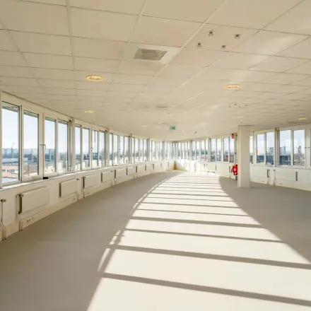 Spacious interior at Dokter van Deenweg 1, Zwolle, perfect for office space rental with large windows offering ample natural light.
