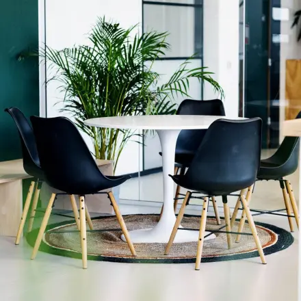 Stylish, furnished office space with a round table and chairs, ideal for meetings or gatherings in Zwolle.