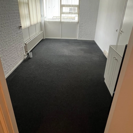 Unfurnished office space with carpeted flooring and large windows, ideal for customizable setups. This office to rent at Pascalweg 6 in Zwolle offers natural light, perfect for a productive work environment.