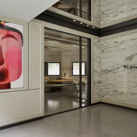 Moderne kantooringang met marmeren muren en grote kunst aan de muur bij Weteringschans 126, Amsterdam Centrum. Ideaal voor kantoorruimte huren.