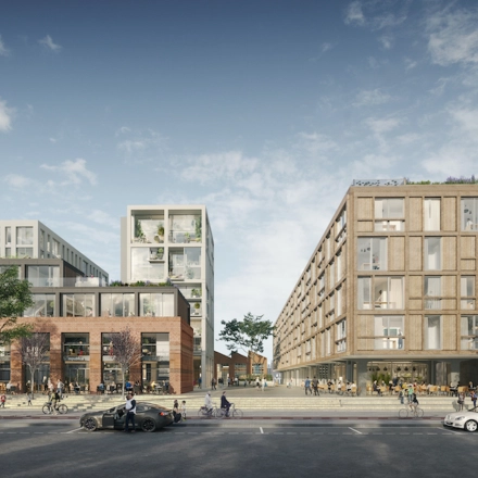 Een modern kantoorpand gelegen aan de Papaverhof 58 in Amsterdam Noord met mensen die fietsen en wandelen in de omgeving.