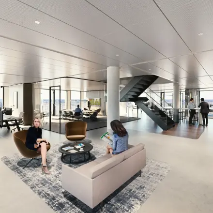 Moderne kantoorruimte in Amsterdam West met open werkplekken en loungegebied, waar mensen aan het werk zijn en gesprekken voeren. Veel glas en strakke lijnen definiëren het interieur van deze te huren ruimte.