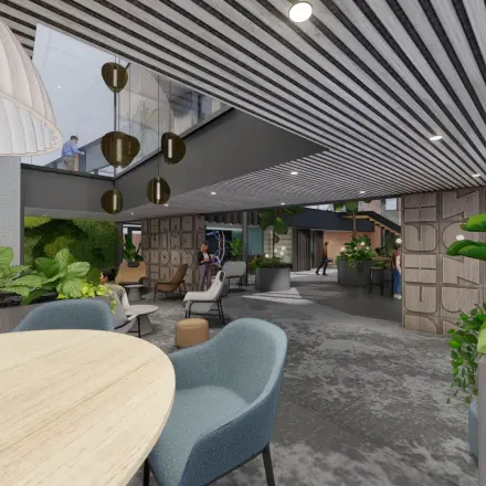 Ruime kantoorruimte met moderne inrichting in Amsterdam Zuidas, Jachthavenweg 109, geschikt voor huur. Grote ramen, stijlvolle meubels en veel groen maken het pand uitnodigend voor zakelijke activiteiten.