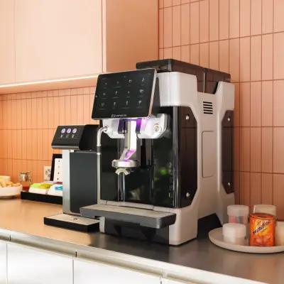 Ein moderner Kaffeebereich in einem Büroraum in Zürich Enge, Beethovenstrasse 48, perfekt um während der Arbeit eine Pause zu machen. Ideal für Unternehmen, die Büroräume mieten möchten.