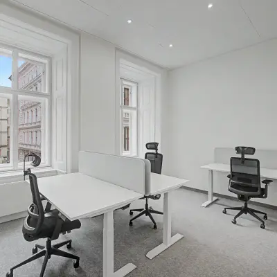Bright and modern furnished office space at Wollzeile 11, 1010 Vienna Center, available for rent with desks and ergonomic chairs.