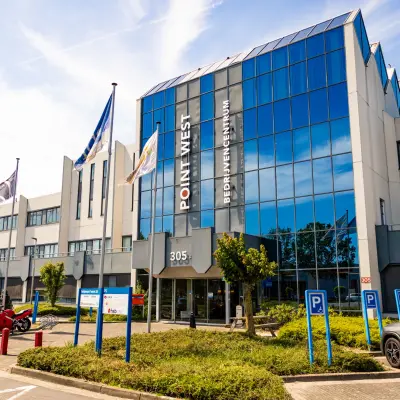 Exterior view of the office building at Bedrijvenpark Twente 305, Almelo, showcasing available office space rental options.