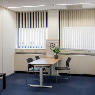 Bright office space rental available with a table and chairs at Markerkant 1310, Almere Stad. Ideal office to rent for meetings or collaborative work.