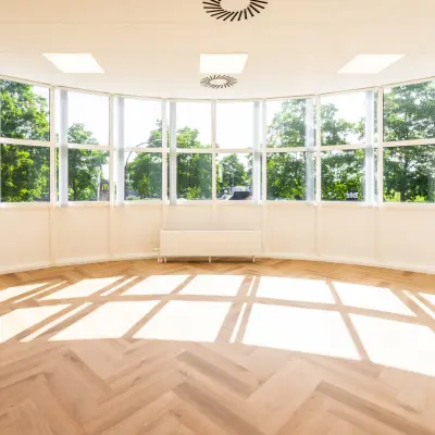 Bright office space with large windows and herringbone flooring at Maanlander 43, perfect for rent office space in Amersfoort Calveen.