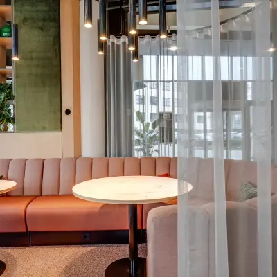 Stylish office lounge area at Maanlander 47, Amersfoort Calveen, perfect for office space rental with a cozy seating arrangement and modern decor.