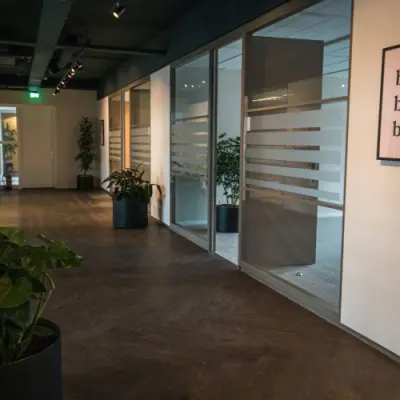 Interior hallway at Ruimtevaart 24, Amersfoort Calveen, ideal for office space rental with glass partitioned offices.