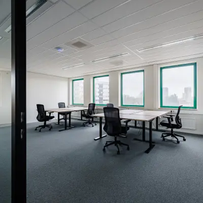 Spacious, bright office to rent at Stadsring 201, Amersfoort Centrum, featuring multiple desks and chairs, suitable for collaborative work activities.