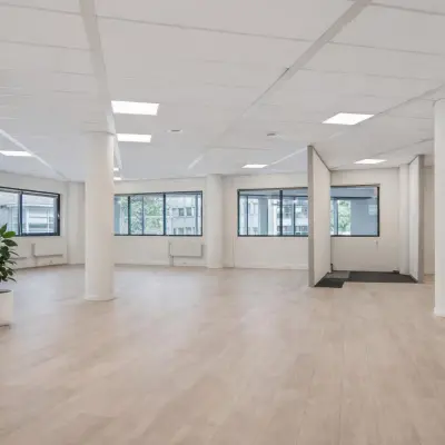 Spacious office space with large windows and light flooring at Asch van Wijckstraat. Perfect for rent office activities in Amersfoort Centrum.