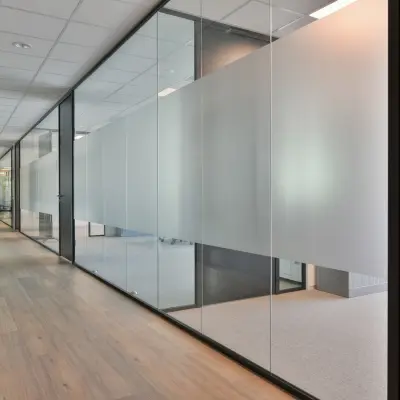 Modern hallway at office space rental in Amstelveen with glass doors and light wood flooring at De Gondel 1.