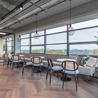 Chic office space featuring stylish seating and large windows at Joop Geesinkweg 201 in Amsterdam Amstel Business Park. Ideal for companies seeking office space rental opportunities.