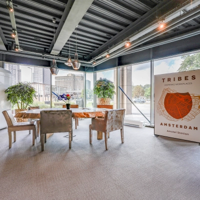 Modern office space with large windows and a meeting area at Prins Bernhardplein 200, ideal for office space rental in Amsterdam Amstel.