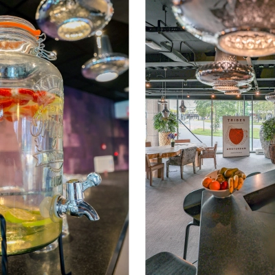 Modern office to rent at Prins Bernhardplein 200, Amsterdam Amstel, featuring a stylish meeting area with a view of the outdoors and a refreshing water station.