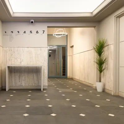 Interior view of an office entrance at Kleine Gartmanplantsoen 21, Amsterdam Center, highlighting the minimalist design ideal for those seeking office space rental.