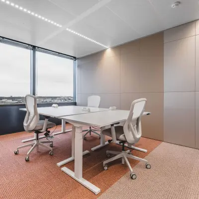 Bright office space with modern furnishings at Piet Heinkade 55, offering a panoramic view, ideal for those seeking office space rental in Amsterdam Center.