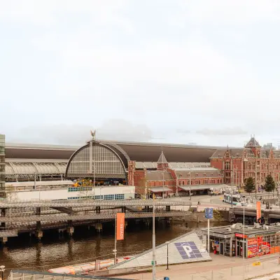 Scenic view of Amsterdam Center featuring Prins Hendrikkade 14, ideal for office space rental with nearby transportation links.