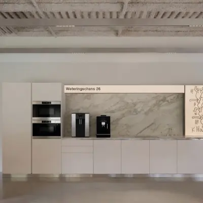 Modern office space at Weteringschans 126 in Amsterdam Center with sleek kitchen facilities and adjacent conference area, ideal for office space rental.