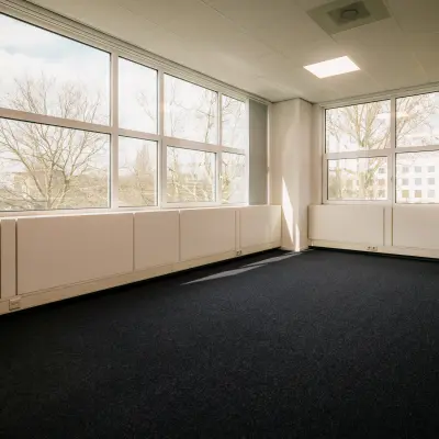 Bright office space rental at Overschiestraat 182, Amsterdam De Schinkel, featuring large windows and ample natural light.