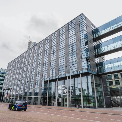 Street view of Piet Heinkade 95B, Amsterdam East, showcasing a modern office building available for rent office space.