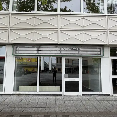 Exterior view of the office building at Buikslotermeerplein 430, Amsterdam North featuring modern facade with large windows, available for office space rental.
