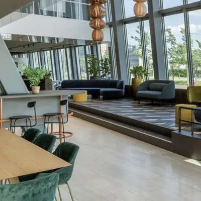 Spacious and modern office space with stylish furniture and large windows at David Ricardostraat 1, Amsterdam Riekerpolder, perfect for office space rental.