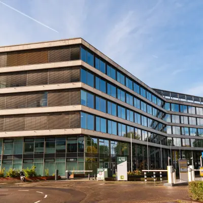 Modern office building exterior at John M. Keynesplein 4-10, Amsterdam Riekerpolder, suitable for office space rental.
