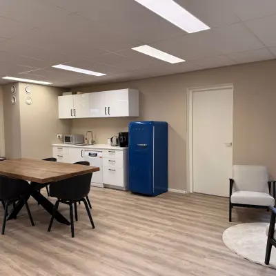 Well-lit office space with a modern dining area and kitchenette at Arlandaweg 92, ideal for an office space rental in Amsterdam Sloterdijk.
