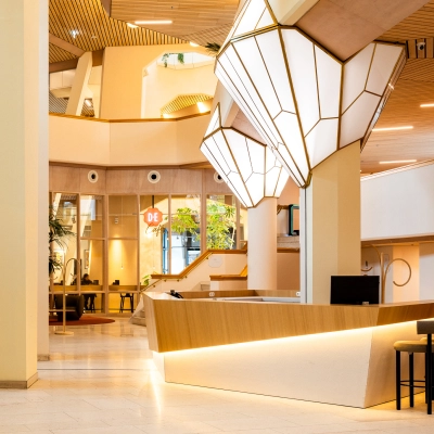 Modern office to rent featuring a stylish reception area with sleek lighting and contemporary design at Bijlmerplein 888, Amsterdam South East.