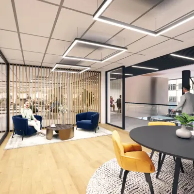 Modern office space with stylish furniture at Herikerbergweg 290, Amsterdam South East, ideal for rent. People engaging in discussions and utilizing workspaces.