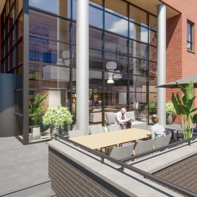 Outdoor seating area at Hogehilweg 24, Amsterdam South East with people meeting and discussing business activities. The modern office exterior features glass and red brick architecture.