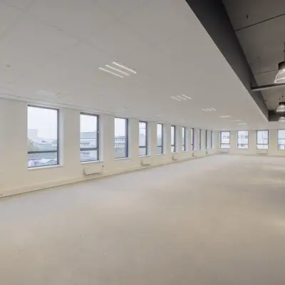 Spacious and unfurnished office space at Hogehilweg 24 in Amsterdam South East, ideal for those seeking an office to rent with abundant natural light and modern lighting fixtures.
