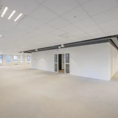 Bright and spacious office to rent at Hogehilweg 24, featuring an open floorplan with ample windows for natural light in Amsterdam South East.