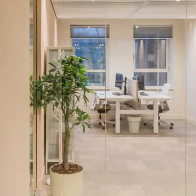 Bright office space for rent in Amsterdam South East, featuring modern workstations and large windows at Hullenbergweg 109-135.