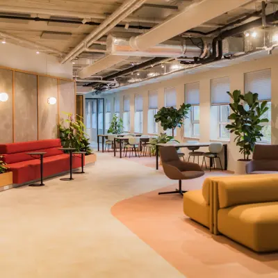 Modern office to rent at Hullenbergweg 109-135, Amsterdam South East, featuring stylish furniture and vibrant natural light.