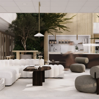 Stylish office to rent in Amsterdam South East with modern seating, lush plants, and a well-equipped coffee area, perfect for hosting informal meetings.