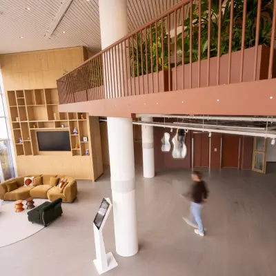 Spacious office to rent at Luttenbergweg 8, Amsterdam South East, featuring modern furnishings and a large open floorplan.