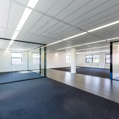 Spacious office to rent at Paasheuvelweg 20 20, in Amsterdam South East, featuring a large open floor plan with glass partitions and ample natural light.