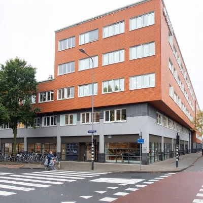 Exterior view of an office building at Haarlemmerweg 331, Amsterdam West, ideal for office space rental.