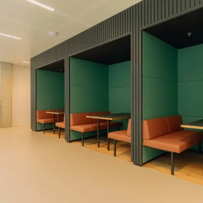 Modern alcove seating area in a stylish office at Kon. Wilhelminaplein 4, ideal for rent office space in Amsterdam West.
