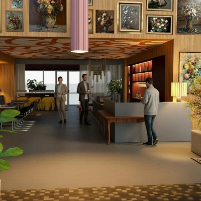 Stylish office space with art-adorned walls, where people are engaged in conversation and work activities. Ideal office space rental in Amsterdam Zuidas.