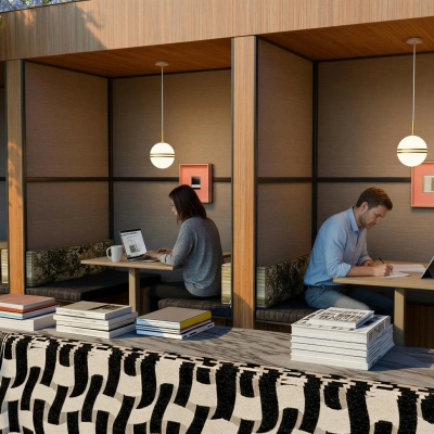 Cozy office spaces at Barbara Strozzilaan 101 101, Amsterdam Zuidas, with individuals working on laptops, ideal for office space rental.